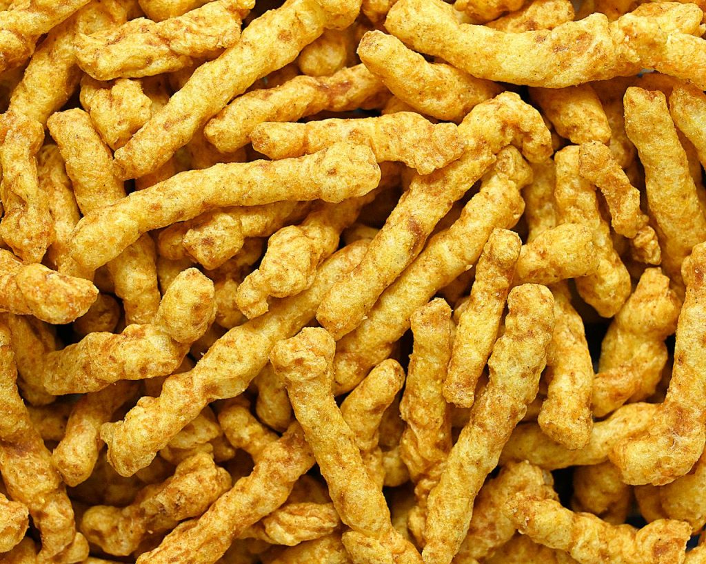 High-resolution image of crunchy, golden-brown fried snack sticks from Pune, India.